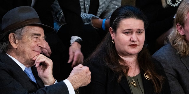 Oksana Markarova, Ukraine's ambassador to the United States, right, and Paul Pelosi, husband of Rep. Nancy Pelosi, D-Calif., are seen as Markarova is recognized during the president's State of the Union address Biden in the House Chamber of the US Capitol on February 7, 2023. 