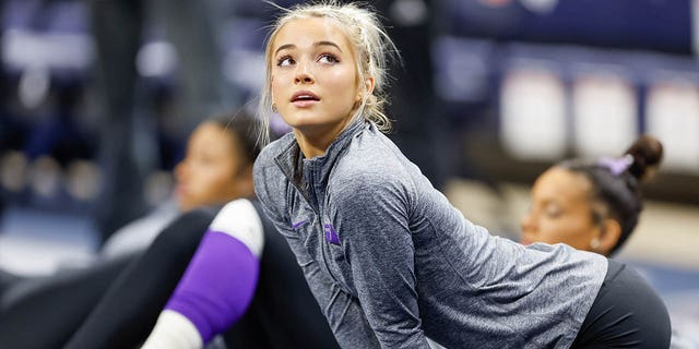 LSU's Olivia Dunn stretches before a meet at Neville Arena on February 10, 2023 in Auburn, Alabama.