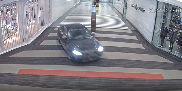 A 2011 black Audi is seen racing through the inside of the Vaughan Mills mall in Ontario, Canada, on Feb. 1, 2023.