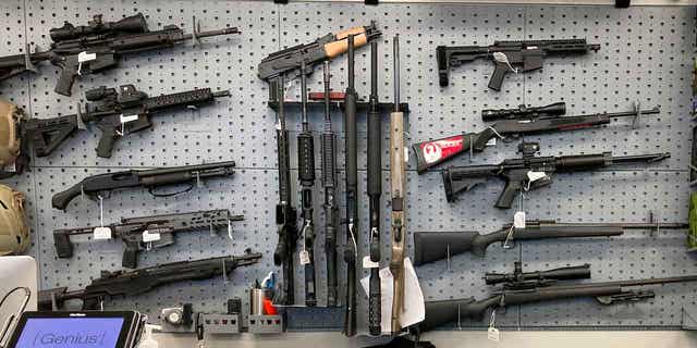 Firearms are displayed at a gun shop in Salem, Oregon, on Feb. 19, 2021. In a ruling on Feb. 9, 2023, the state's Supreme Court refused to overturn a ruling blocking a gun measure from taking effect. 