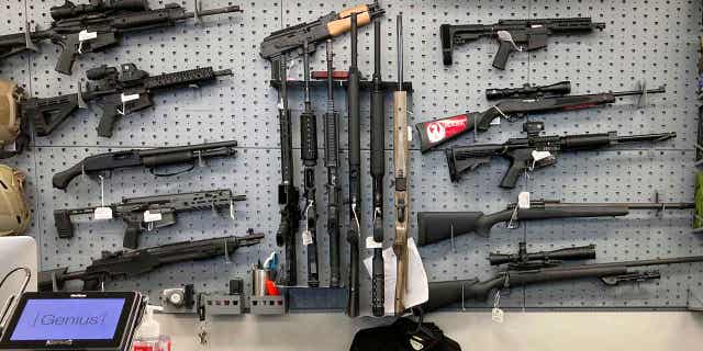 Firearms are displayed at a gun shop in Salem, Oregon, on Feb. 19, 2021. In a ruling on Feb. 9, 2023, the state's Supreme Court refused to overturn a ruling blocking a gun measure from taking effect.