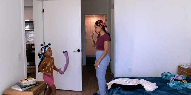 An Illinois woman brushes her teeth as she prepares for work on Feb. 10, 2023, in Chicago.