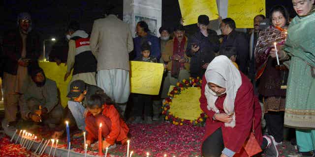 A candlelight vigil for the victims of Monday's suicide bombing is held in Quetta, Pakistan, on Feb. 2, 2023. A suicide bomber killed 101 people at a mosque in northwest Pakistan this week. Pakistani troops also killed 2 insurgents at a militant hideout near the Afghanistan border.