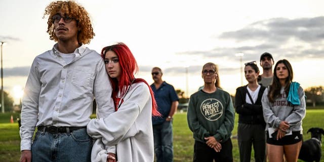 People attend a spiritual service for the victims of Marjory Stoneman Douglas High School shooting, on the fifth anniversary of the massacre, in Parkland, Florida, on February 14, 2023. - Seventeen people were killed and another seventeen were injured after a 19 year old former student opened fire at the school on February 14, 2018.