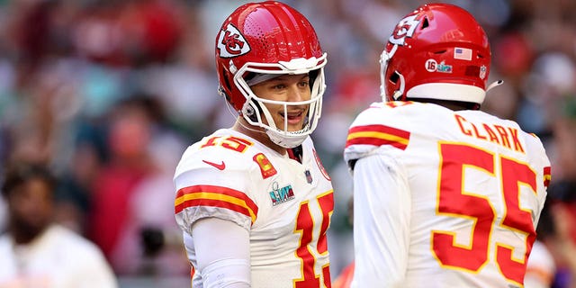 Patrick Mahomes #15 and Frank Clark #55 of the Kansas City Chiefs talk on the field before playing the Philadelphia Eagles in Super Bowl LVII at State Farm Stadium on February 12, 2023 in Glendale, Arizona.