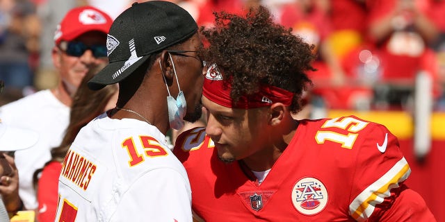 Kansas City Chiefs quarterback Patrick Mahomes (15) hugs his dad before an AFC West matchup against the Los Angeles Chargers Sept. 26, 2021, at GEHA Filed at Arrowhead Stadium in Kansas City, Mo.
