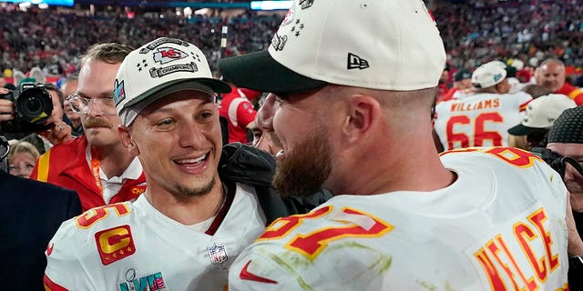 Kansas City Chiefs quarterback Patrick Mahomes (left) and tight end Travis Kelce celebrate defeating the Philadelphia Eagles after the NFL Super Bowl LVII football game Sunday, February 12, 2023, in Glendale, Arizona.