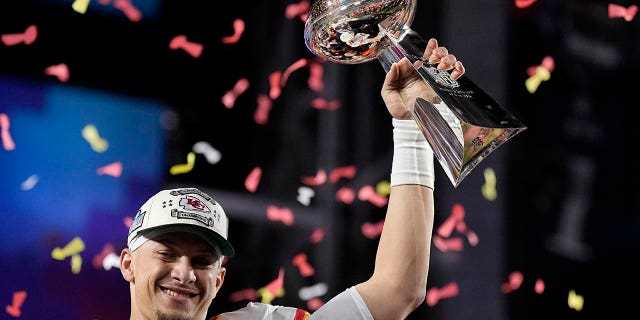 Kansas City Chiefs quarterback Patrick Mahomes holds the Vince Lombardi Trophy after winning Super Bowl LVII, Sunday, February 12, 2023.