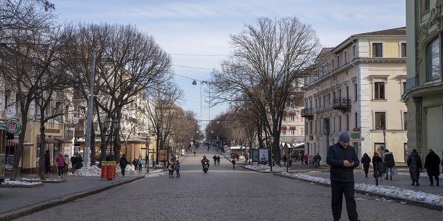 People walk in the streets of Odesa, Ukraine on Feb. 1, 2023. 