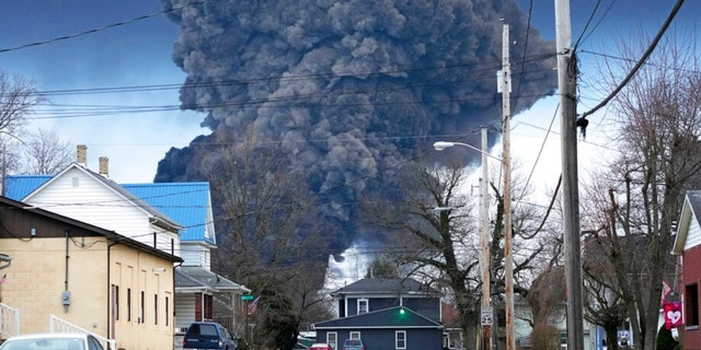 A large plume of smoke rises over East Palestine, Ohio, following the controlled detonation of part of a derailed Norfolk Southern train on Monday, Feb. 6, 2023.  About 50 wagons, including 10 with hazardous materials, derailed in a fiery accident.  Federal investigators say the cause of the derailment was a mechanical failure of the wagon's axle. 