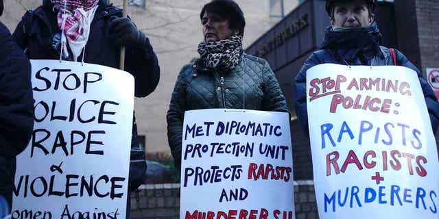 Demonstrators protest outside Southwark Crown Court in London ahead of the sentencing of David Carrick on Feb. 7, 2023. Carrick was sentenced to life in prison with a minimum term of 30 years for raping and sexually assaulting a dozen women over a 17-year period. 