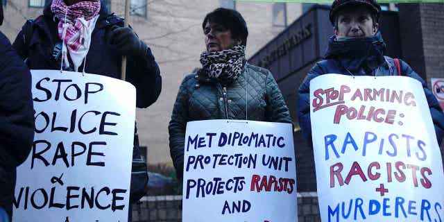Demonstrators protest outside Southwark Crown Court in London ahead of the sentencing of David Carrick on Feb. 7, 2023. Carrick was sentenced to life in prison with a minimum term of 30 years for raping and sexually assaulting a dozen women over a 17-year period.