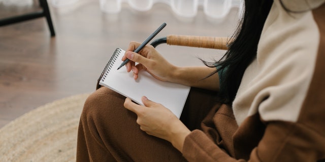 psychologist with pen, notepad stock image