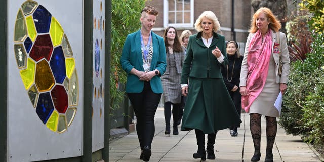 Camilla, Queen Consort, center, talks with Coram CEO Carol Homden, right, and Head of Coram Beabstalk, Amy Lewis, during a visit on Feb. 2, 2023 in London.