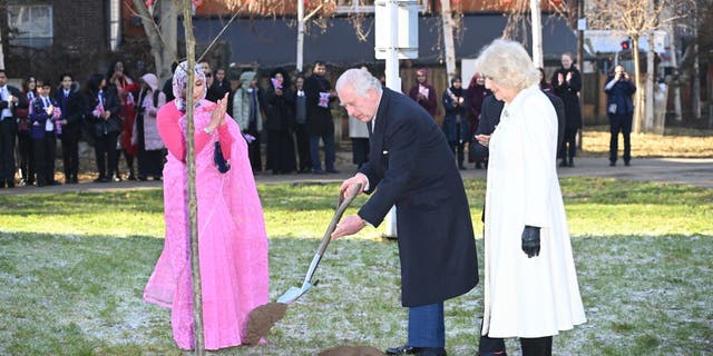 King Charles III, center, and Camilla, Queen Consort, right, plant a tree in the Altab Ali Park during a visit to the Bangladeshi community of Brick Lane on Feb. 8, 2023 in London.