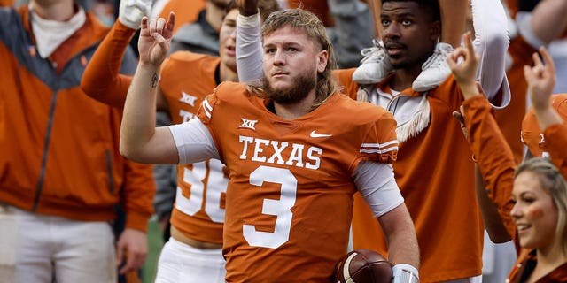 Quinn Ewers #3 of the Texas Longhorns stands for the Eyes of Texas after the game against the Baylor Bears at Darrell K Royal-Texas Memorial Stadium on November 25, 2022 in Austin, Texas.