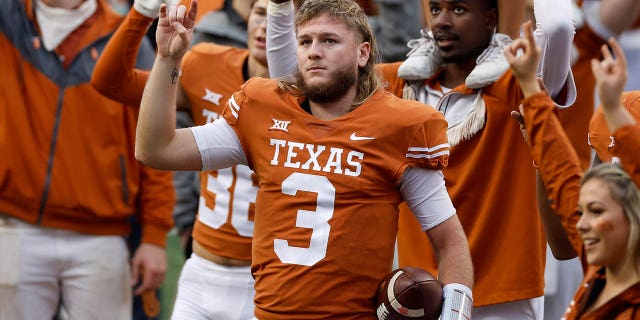 Quinn Ewers #3 of the Texas Longhorns stands for the Eyes of Texas after the game against the Baylor Bears at Darrell K Royal-Texas Memorial Stadium on November 25, 2022 in Austin, Texas.