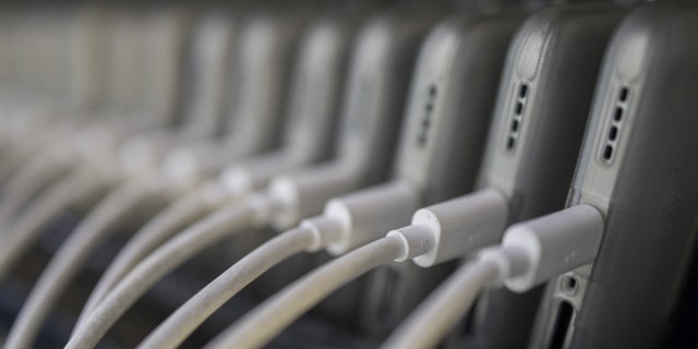 Phones are charged before the dispatch inside the Realme factory in Greater Noida, India, Wednesday, June 1, 2022. 