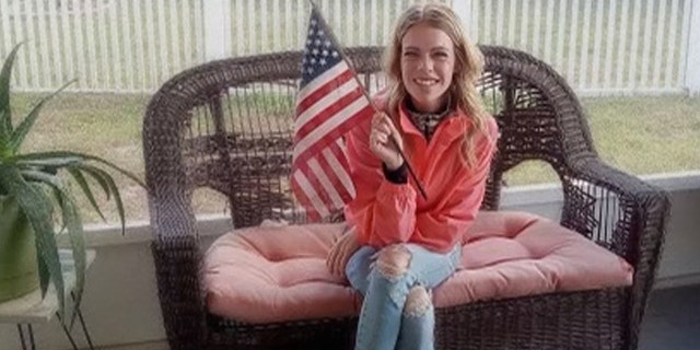 Rachel Schwartz waves an American flag in the porch in an undated family photo.