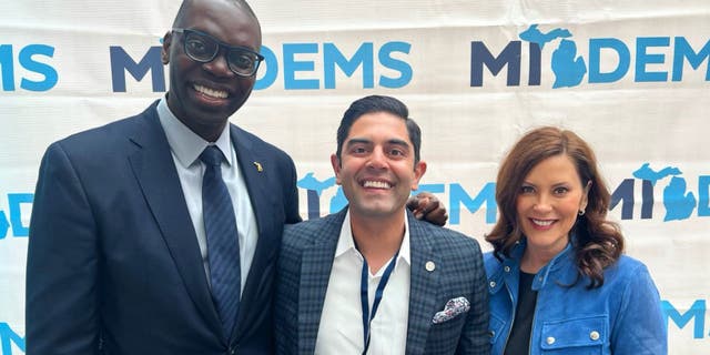Michigan state House Majority Leader Ranjeev Puri, a Democrat, (C) with Democrat Governor Gretchen Whitmer (R) and Lt. Governor Garlan Gilchrist (L).