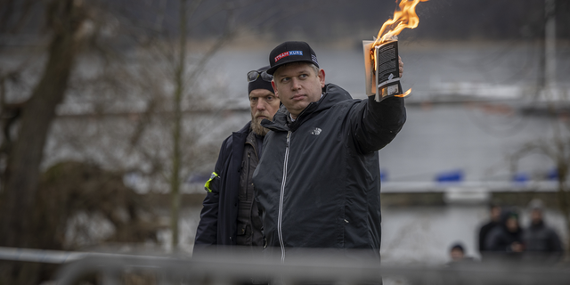 Rasmus Paludan burns the Koran outside the Turkish embassy on Jan. 21, 2023, in Stockholm, Sweden.