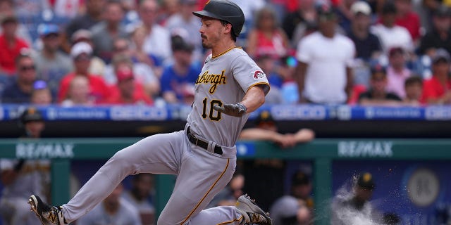 Bryan Reynolds of the Pittsburgh Pirates slides home against the Philadelphia Phillies at Citizens Bank Park Aug. 28, 2022, in Philadelphia.