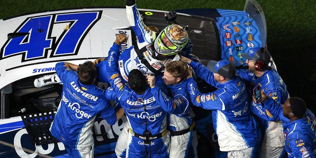 Ricky Stenhouse Jr., driver of the #47 Kroger/Cotonelle Chevrolet, celebrates with his crew after winning the NASCAR Cup Series 65th Annual Daytona 500 at Daytona International Speedway on February 19, 2023 in Daytona Beach, Florida.