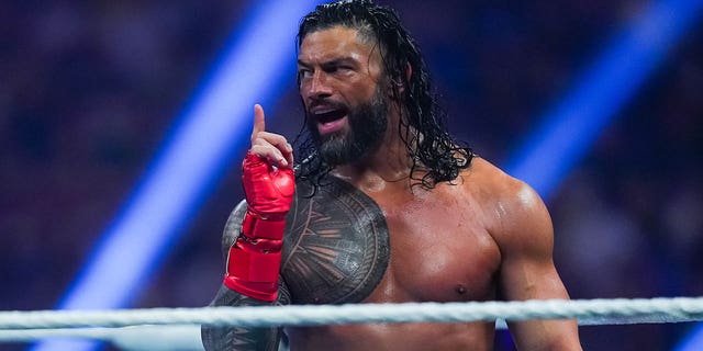 Roman Reigns gestures during the WWE and Universal Championship match at the Alamodome on January 28, 2023 in San Antonio, Texas.