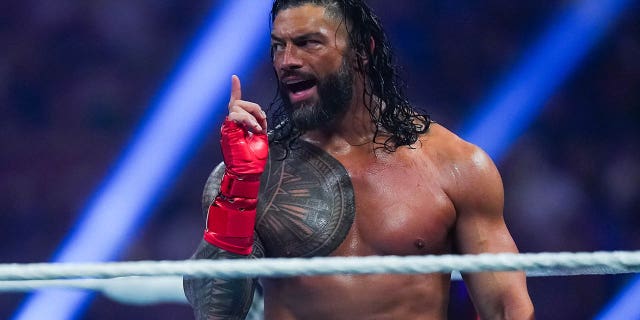 Roman Reigns gestures during the WWE and Universal Championship match at the Alamodome on January 28, 2023 in San Antonio, Texas.