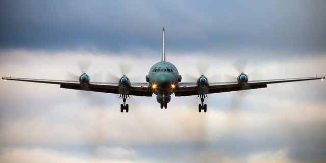 A Russian IL-20M aircraft is seen landing at an unknown location.