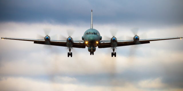 A Russian IL-20M aircraft is seen landing at an unknown location.