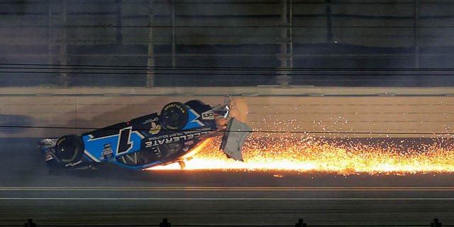 Sam Mayer flips and slides with flames during the NASCAR Xfinity Series Beef.  It's what's for dinner.  300 at Daytona International Speedway on February 18, 2023. 