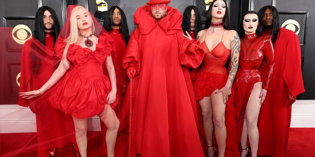 Sam Smith made an entranceway pinch an entourage of dancers dressed successful reddish ensembles.