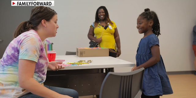 FamilyForward counselor working with a family.