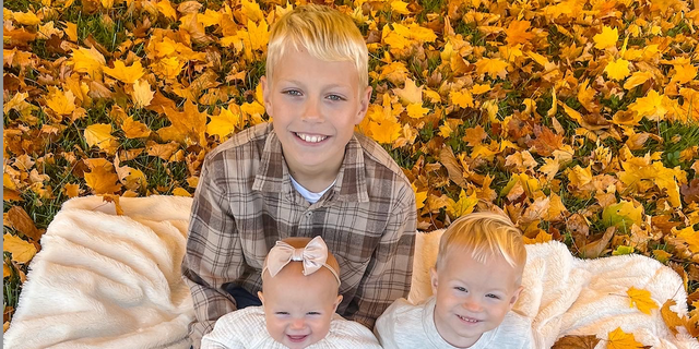 Little Harper Reese with her brothers, Lance (holding Harper) and Hudson. 