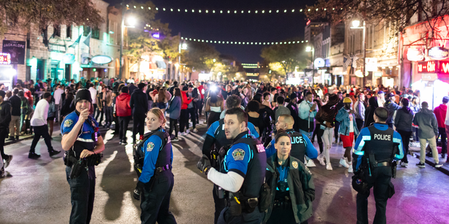 Austin Police patrolling 6th Street, one of the busiest nightlife districts in Austin, TX on Friday, November 6, 2021. 