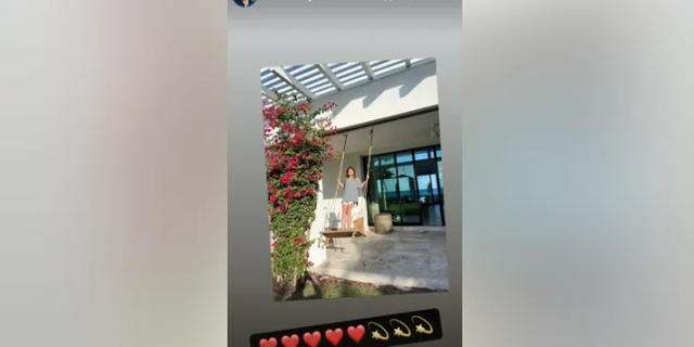 Tom Brady shared this photo on social media of Vivian enjoying the outdoors while standing on a swing. 