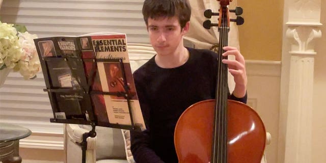 Sebastian Robinson plays the cello with the string orchestra at St. John's Prep in Danvers, Massachusetts. The 12-year-old died in a murder-suicide at his Andover home on Feb. 9, 2023.