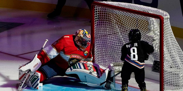 Former Florida Panthers goaltender Roberto Luongo attempts to stop a shot on goal by Sergei Ovechkin, 4, son of Washington Capitals' Alex Ovechkin, during the NHL All Star Skills Showcase,Friday, Feb. 3, 2023, in Sunrise, Florida.