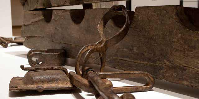 A set of wooden stocks known as tronco, which were used to constrain enslaved people, are seen at the Slavery exhibition Rijksmuseum in Amsterdam, Netherlands, on May 17, 2021. An exhibition on slavery in the Dutch colonial era, first staged at the Rijksmuseum, is being displayed at the United Nations, in New York, from Feb. 27 to March 30.