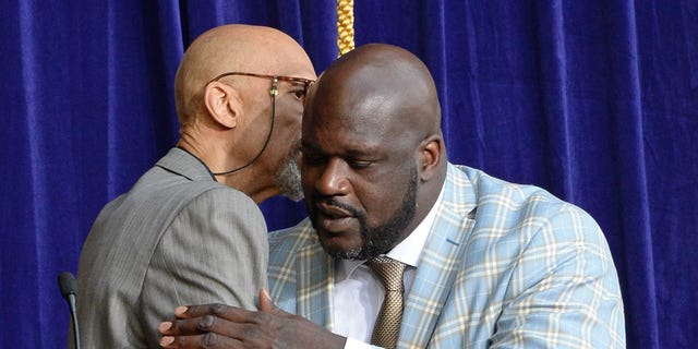Kareem Abdul-Jabbar, left, and Shaquille O'Neal embrace as the Los Angeles Lakers unveil the Shaquille O'Neal statue on March 24, 2017 at Staples Center (now Crypto.com Arena) in Los Angeles.