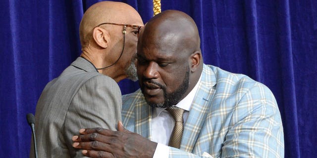 Kareem Abdul-Jabbar, left, and Shaquille O'Neal embrace as the Los Angeles Lakers unveil the Shaquille O'Neal statue on March 24, 2017 at Staples Center (now Crypto.com Arena) in Los Angeles.