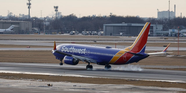 A Southwest Airlines plane lands at Chicago Midway International Airport on Dec. 28, 2022.
