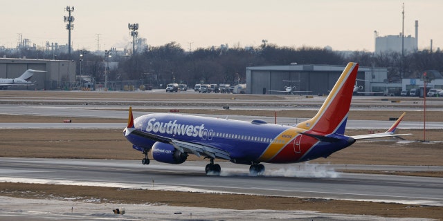 A Southwest Airlines plane lands at Chicago Midway International Airport on Dec. 28, 2022.