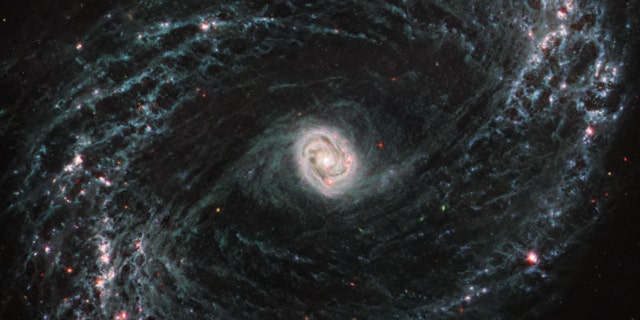 New imagery from NASA’s James Webb Space Telescope is giving scientists their first look at high resolution into the fine structure of nearby galaxies and how that’s impacted by the formation of young stars. NGC 1433 is a barred spiral galaxy with a particularly bright core surrounded by double star forming rings. For the first time, in Webb’s infrared images, scientists can see cavernous bubbles of gas where forming stars have released energy into their surrounding environment. 