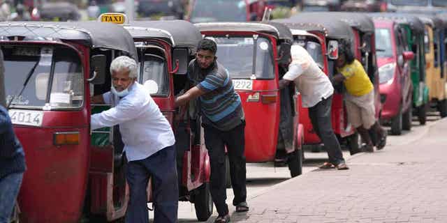 Auto rickshaw drivers line up to buy petrol in Colombo, Sri Lanka April 13, 2022. China expressed support for Sri Lanka ahead of a meeting on February 17, 2023, regarding the nation's debt.