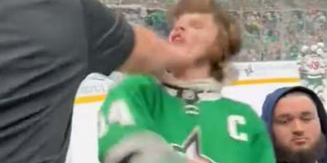 The Dallas Stars fan recoiled backward.