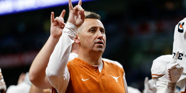 Texas Longhorns head coach Steve Sarkisian sings "The Eyes of Texas" after the Valero Alamo Bowl game against the Washington Huskies at Alamodome on Dec. 29, 2022 in San Antonio.