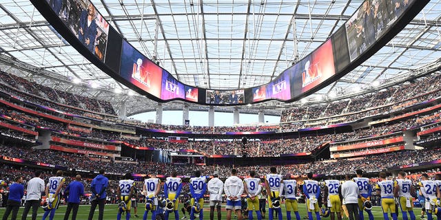 LA Rams players stand for "Lift Every Voice and Sing" ahead of Super Bowl LVI against the Cincinnati Bengals at SoFi Stadium in Inglewood, California, on Feb. 13, 2022.