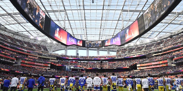 LA Rams players represent "Lift up every voice and sing" before Super Bowl LVI against the Cincinnati Bengals at SoFi Stadium in Inglewood, California on February 13, 2022.